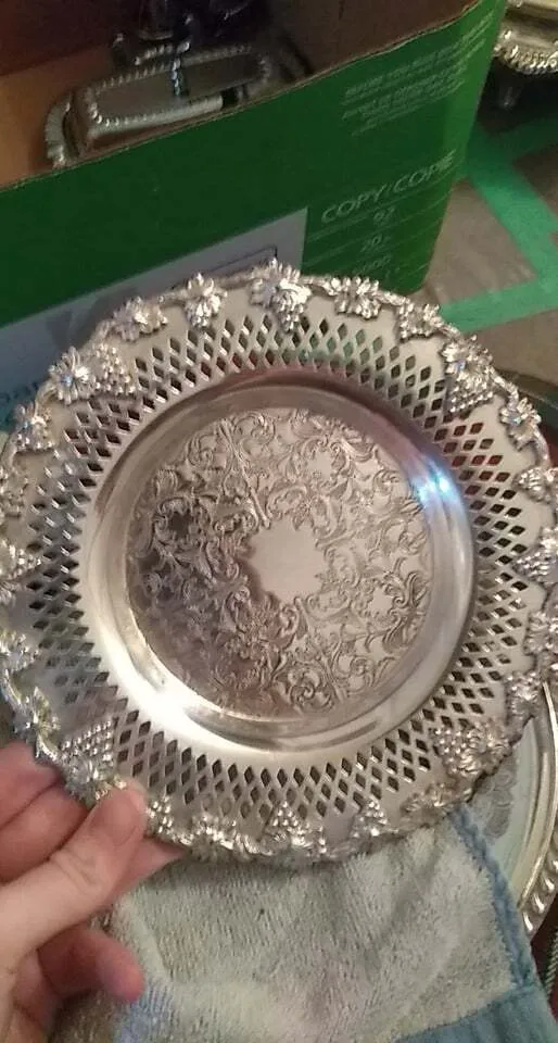 Polished embossed silver plate with grape rim and diamond shaped cut outs