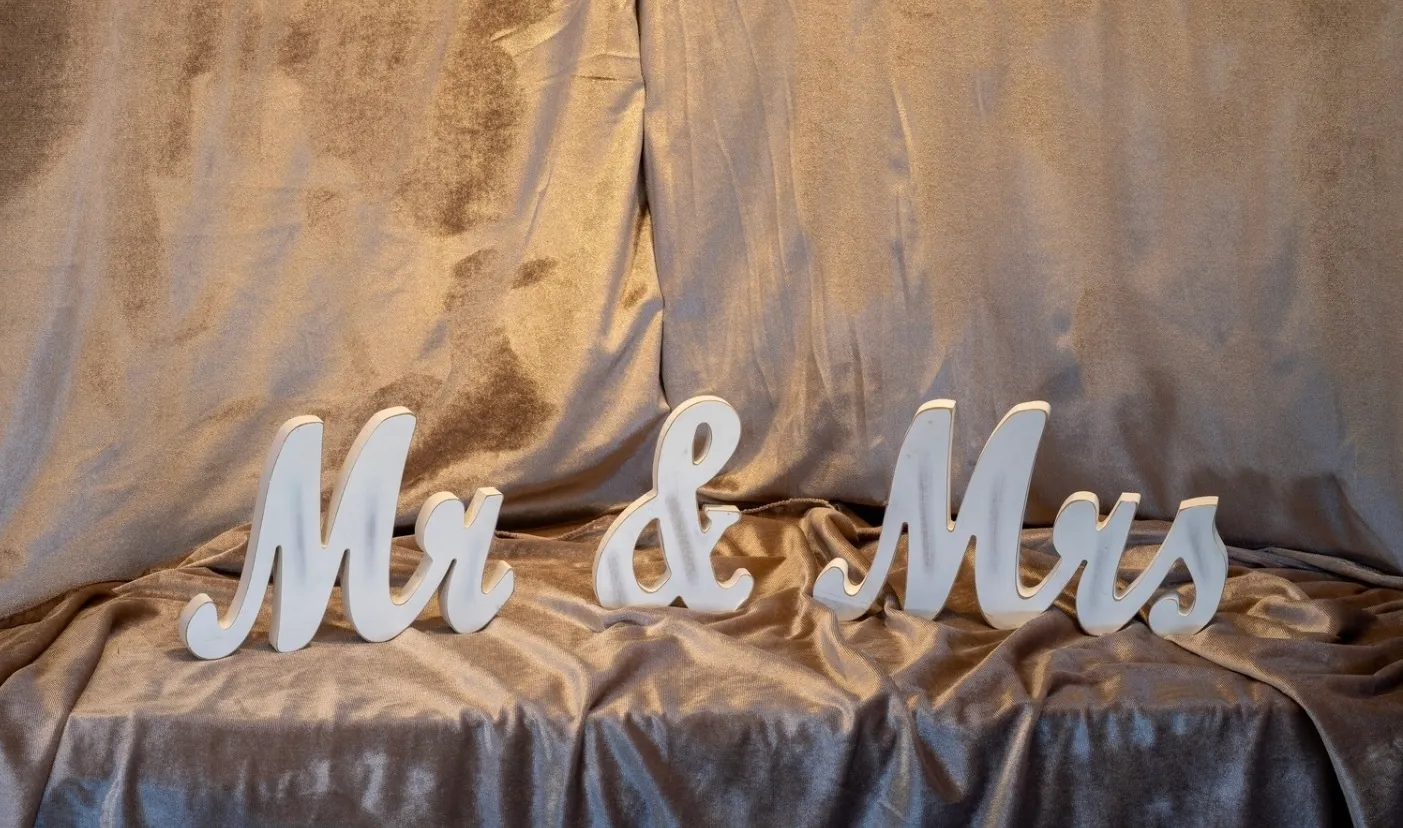 White Wooden “Mr & Mrs” Sign