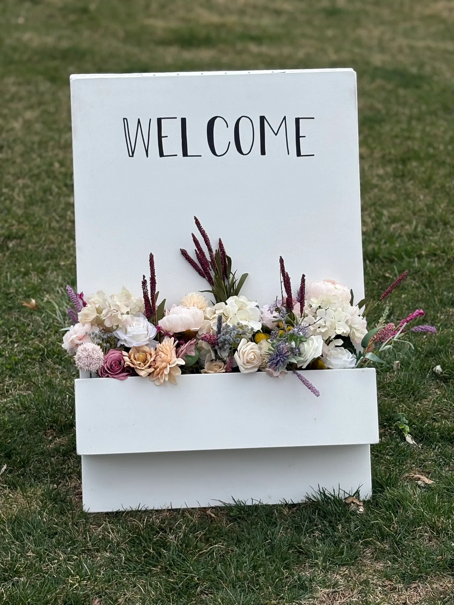 White “Welcome” Sign with Floral Box