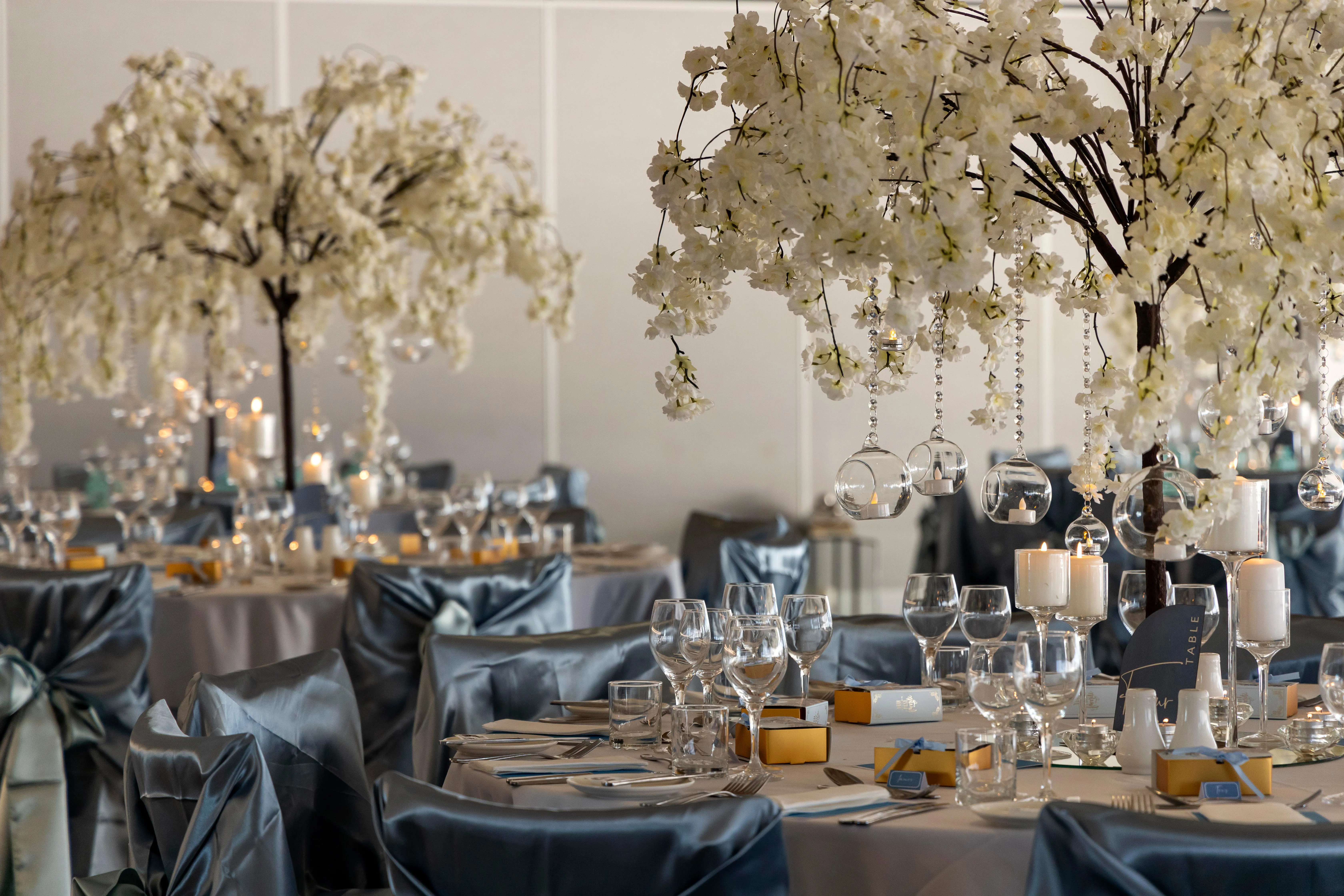 Artificial flower cherry blossom tree decorated with bubble glass hanging tea candle holders 