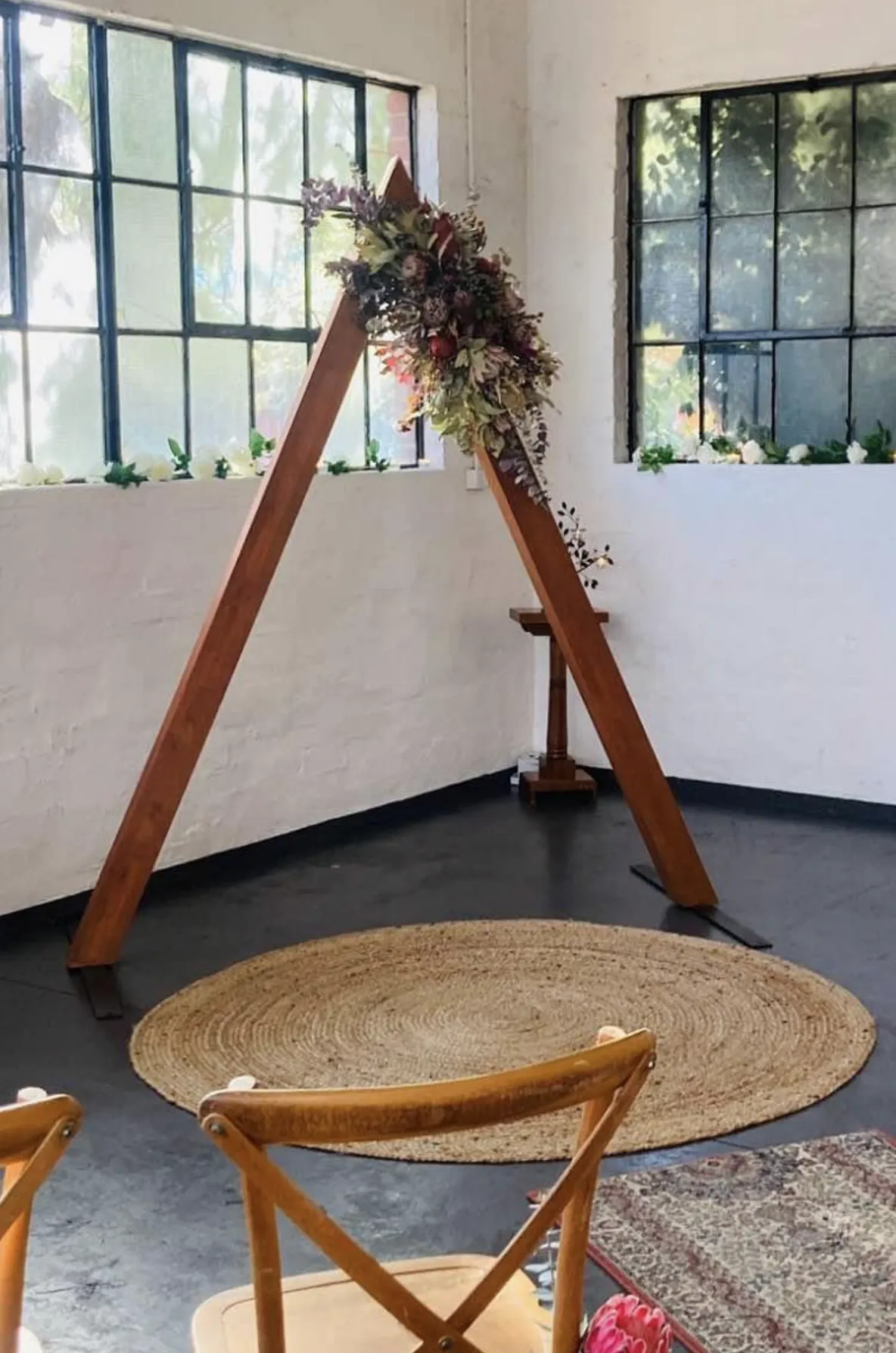 Wedding triangle dark wooden arbour