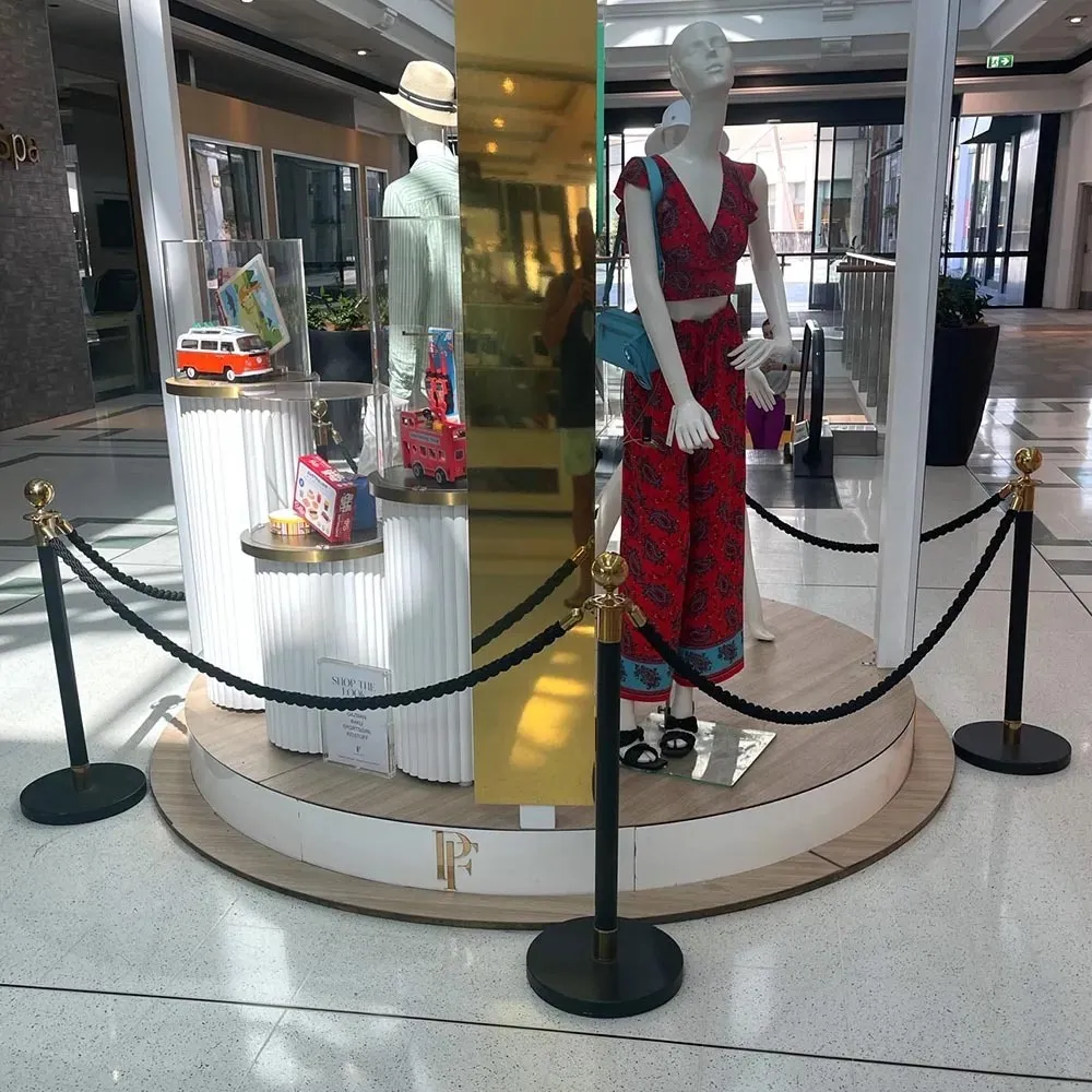 Black and gold  barrier stanchion bollard with black ropes and runner carpet set