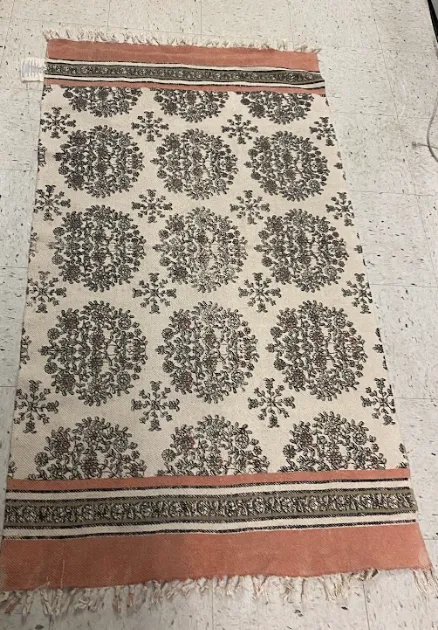 Peach/Tan patterned rug