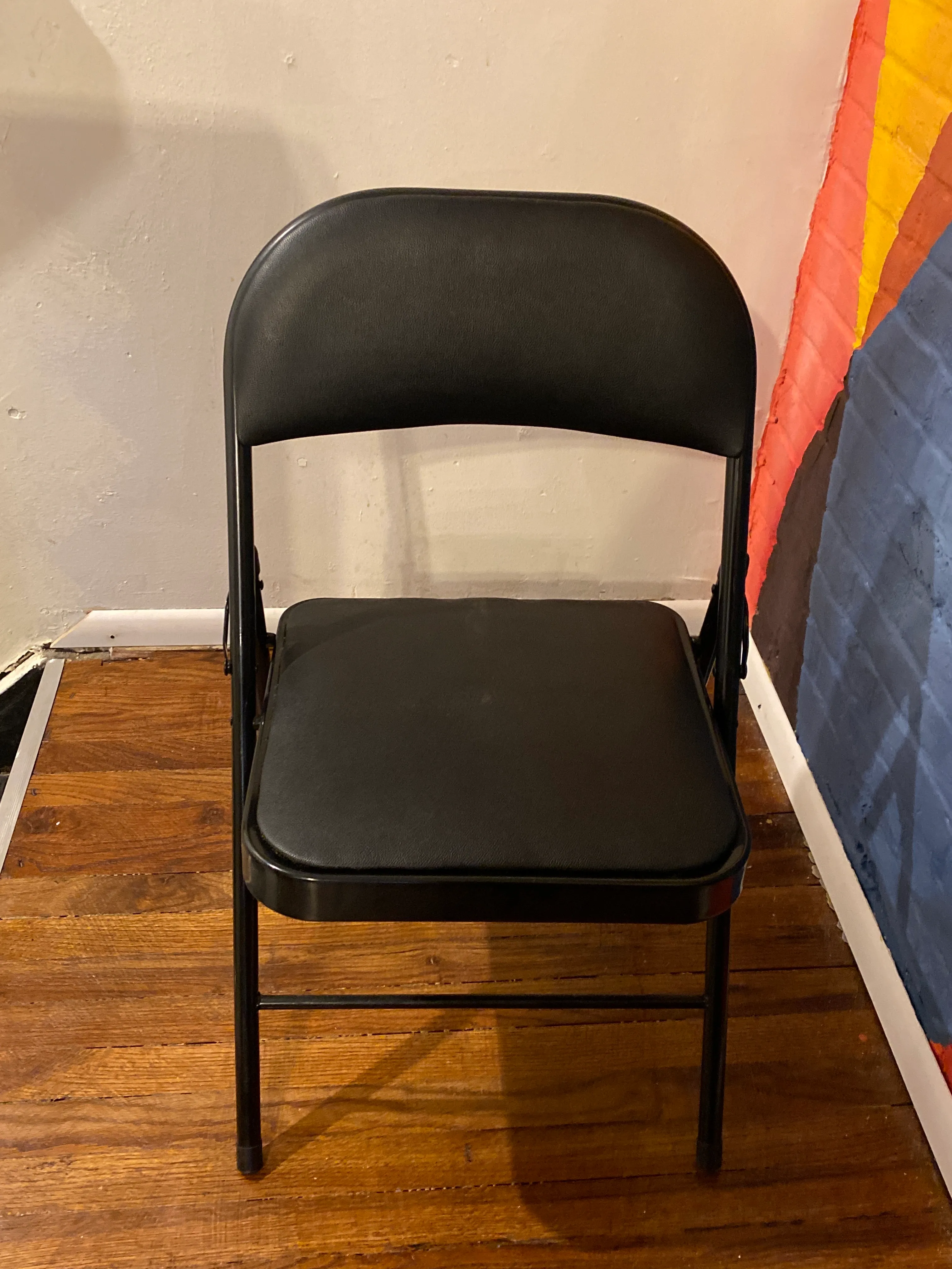 Black Folding Chair with Upholstered Seat