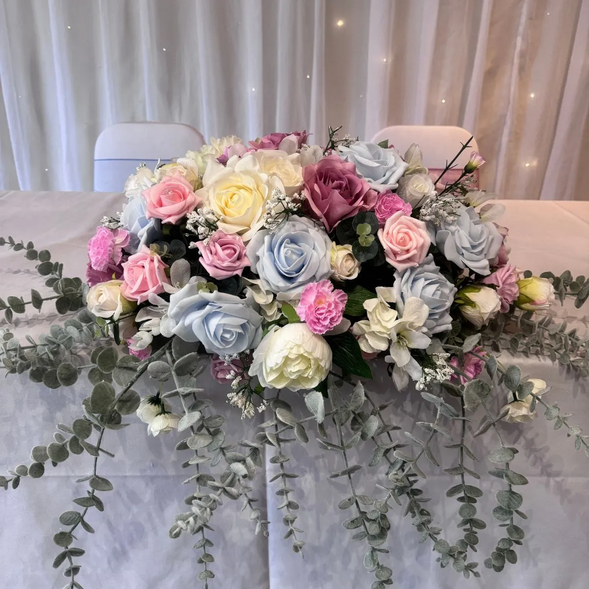White, Blue & Pink Low And Long Flower Arrangement For Hire