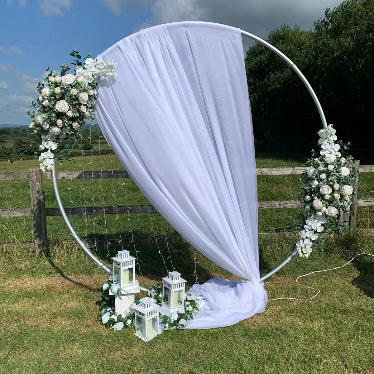 White Draped Hoop & Flower Arrangement Display For Hire
