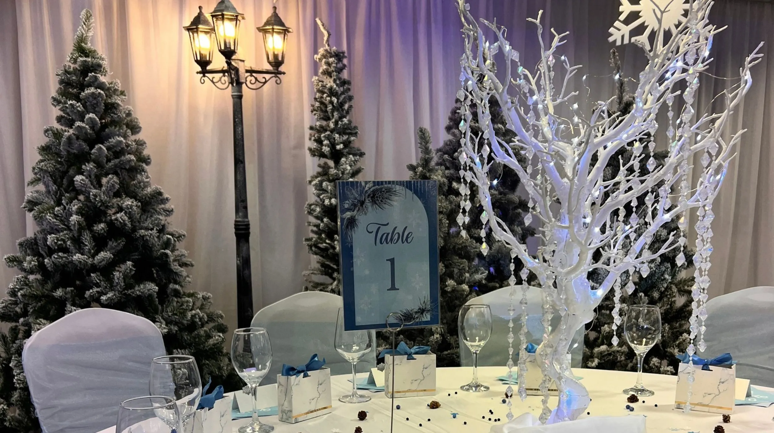 Give your Bristol corporate Christmas party a Winter Wonderland glow with illuminated crystal tree centrepieces and coordinated table styling.