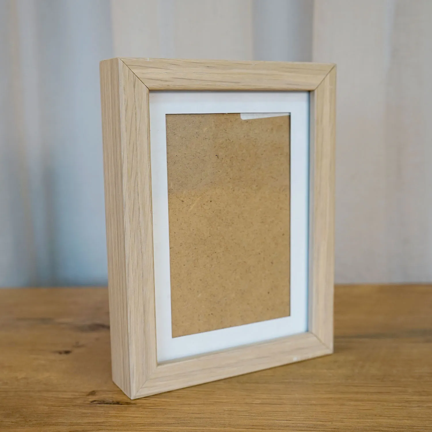 Wooden photo frame with white border