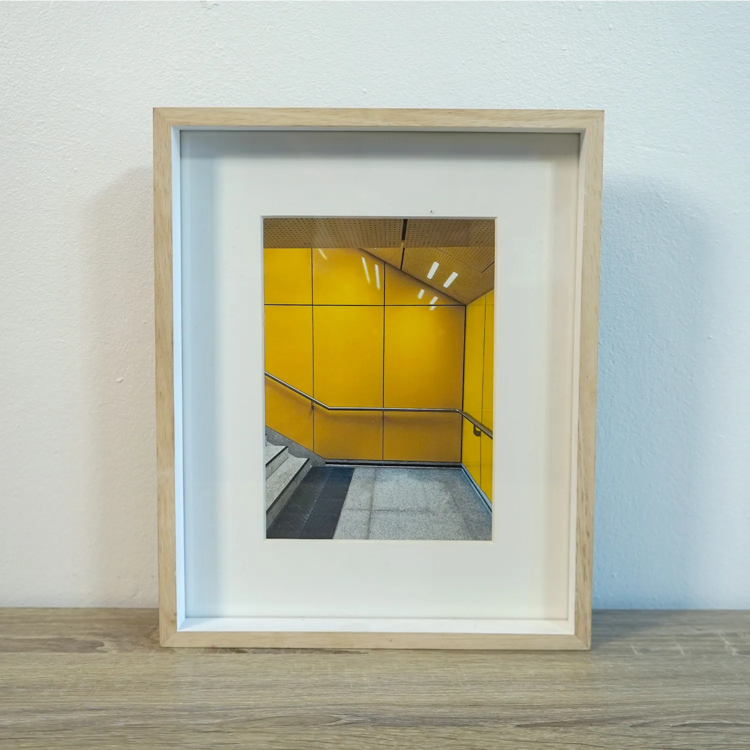 Light Wood rame with royalty ee artwork of a german subway, glass cover