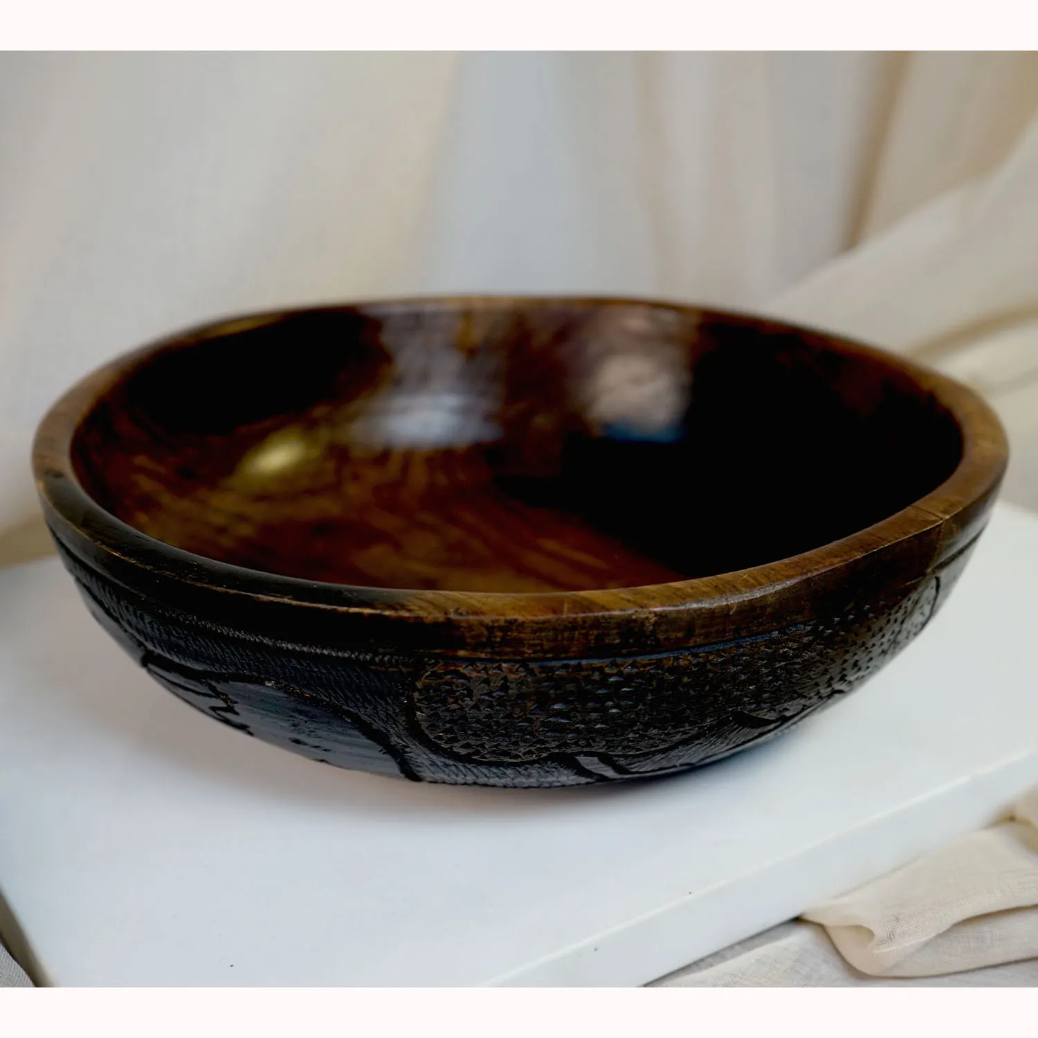 Dark Wooden Bowl with Carvings