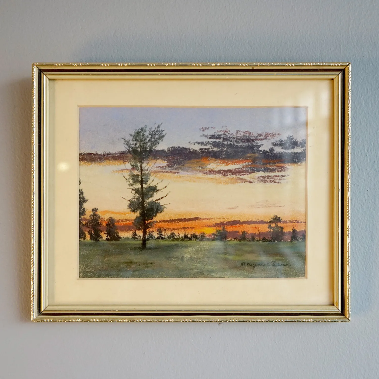 Small landscape artwork with decorative frame