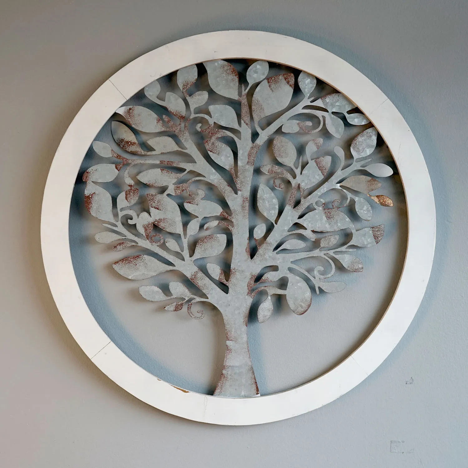 Round metal cutout artwork