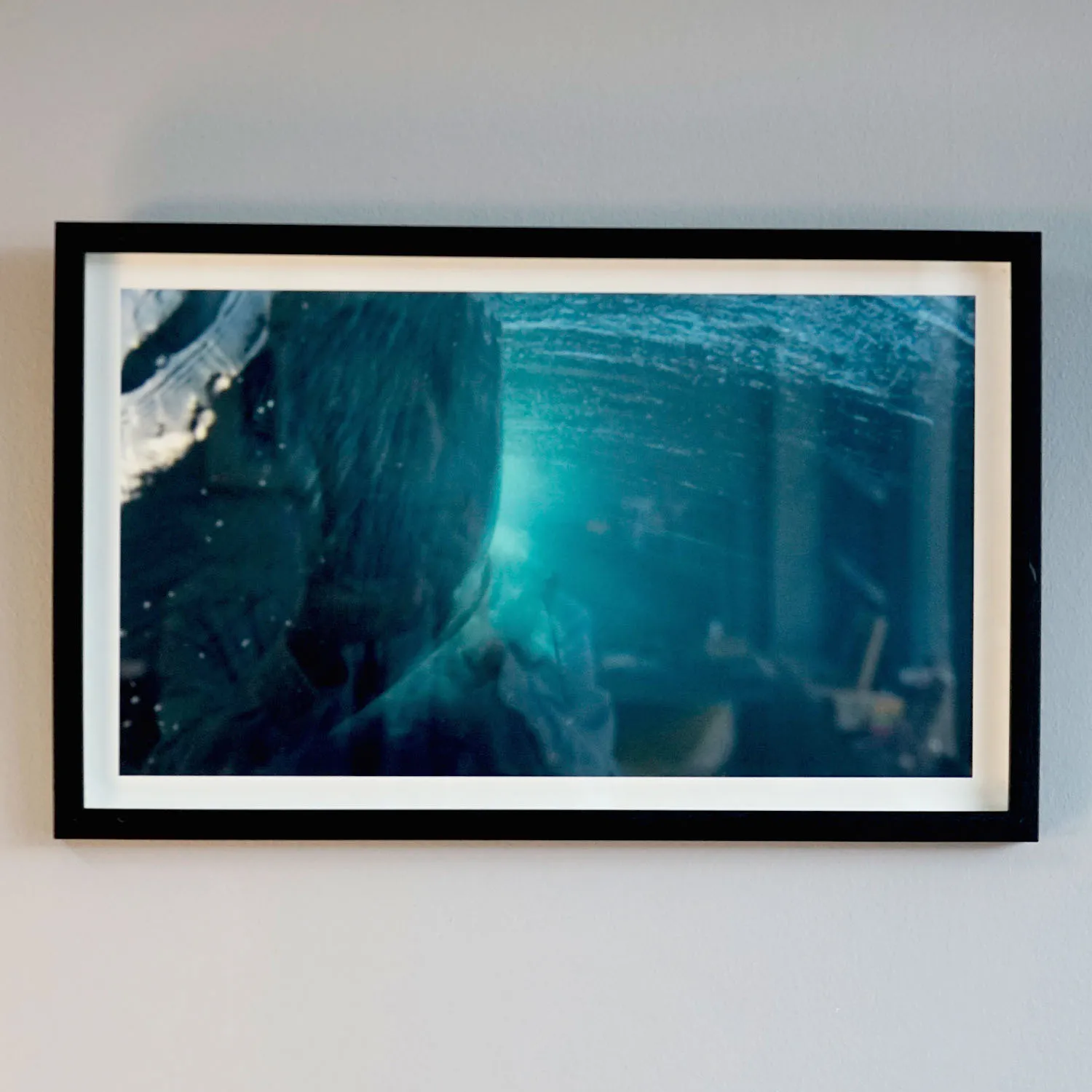Blue Underwater Photo of wave in black frame