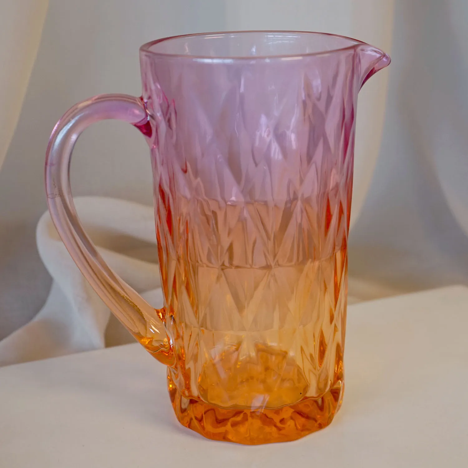 pink and orange glass jug