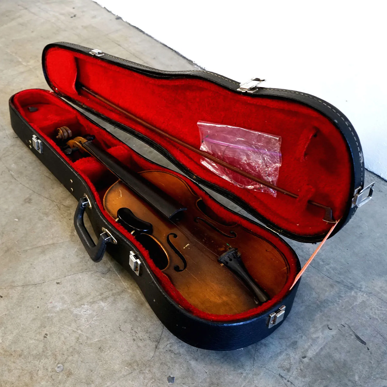 Old Black Violin Case with Red Velvet Interior. 