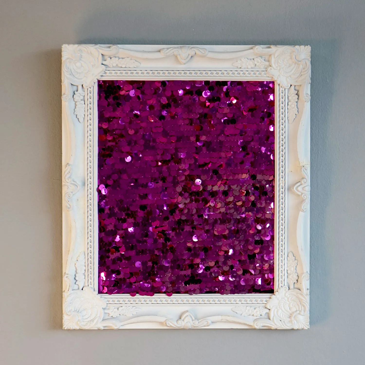 White frame with purple sequins
