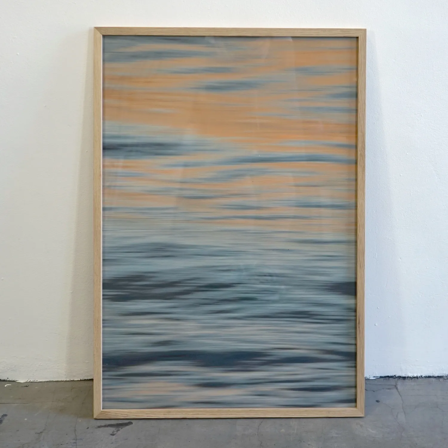 Mid tone wooden frame with royalty free image of water, perspex cover