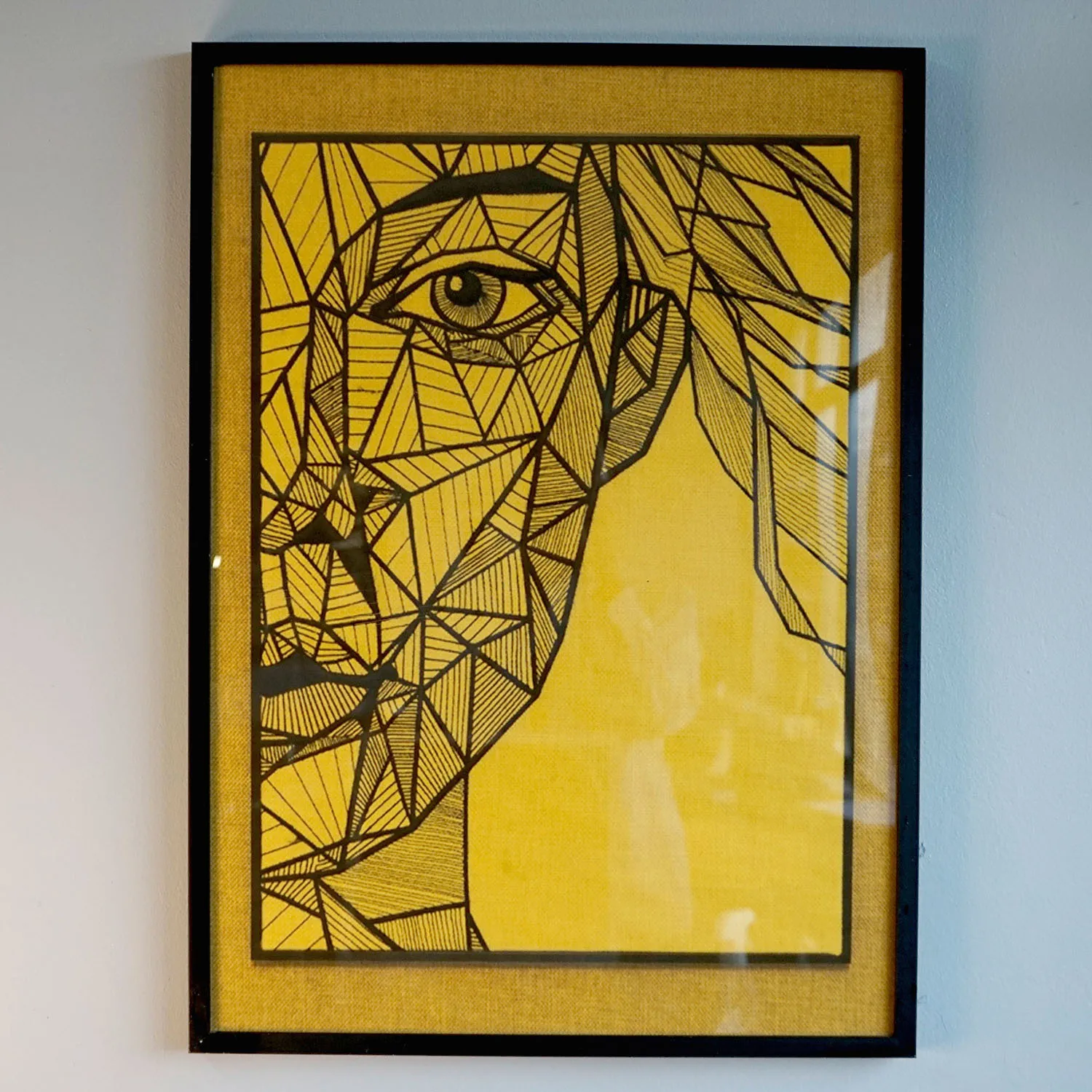 Yellow abstract artwork with black frame