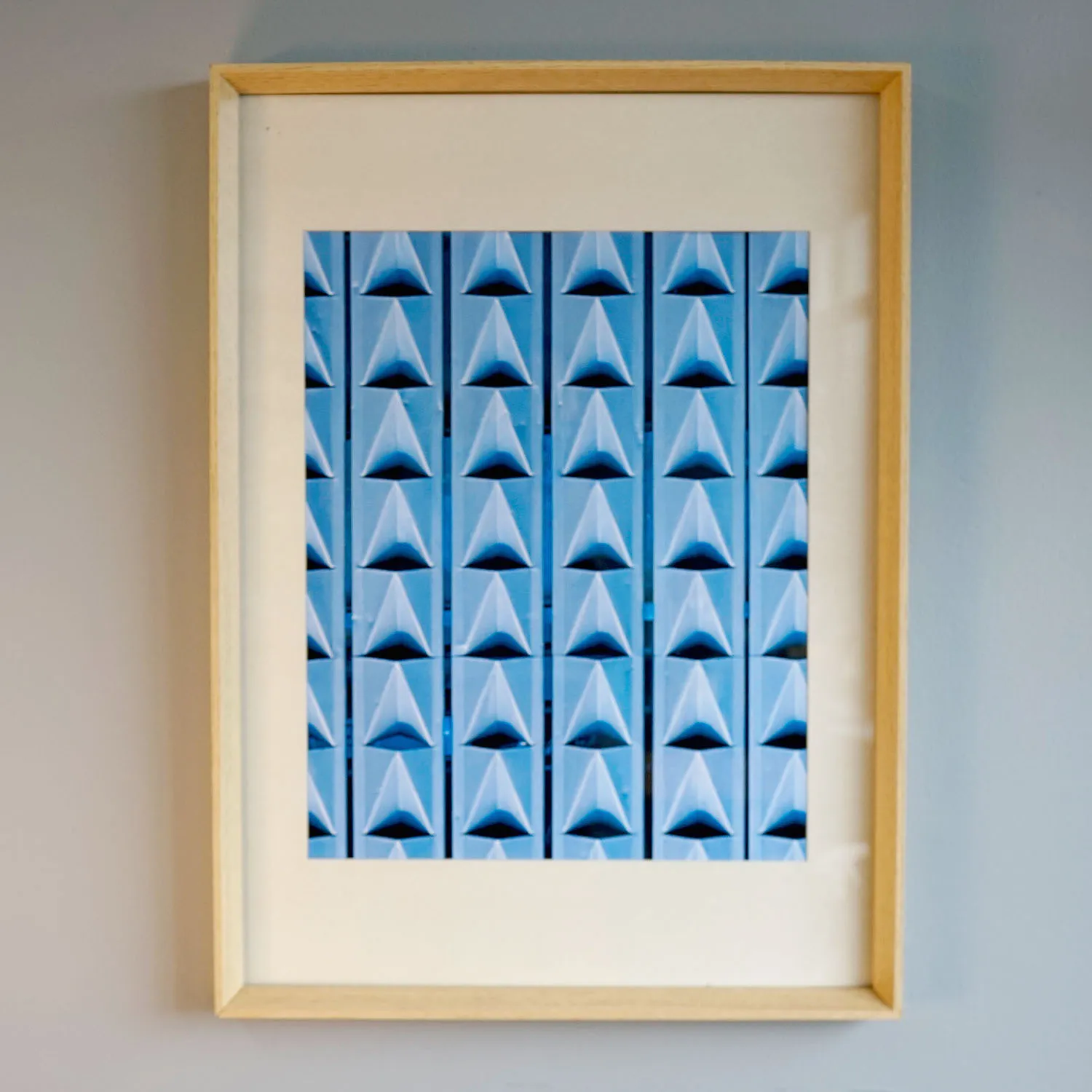 blue geometric print in wooden frame