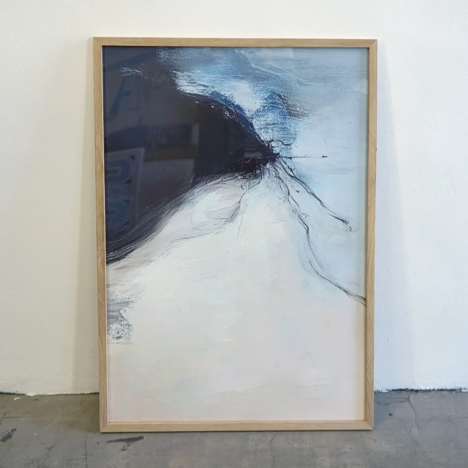 Mid tone wood frame with royalty free abstract image in blue and white, perspex cover