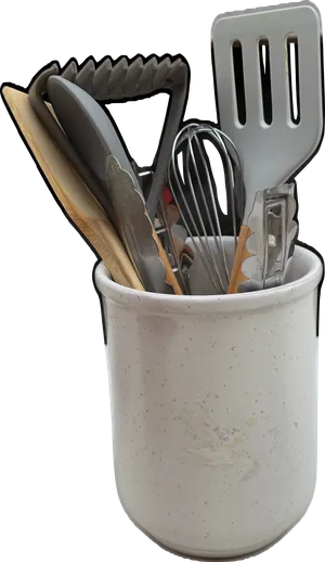 Gray tone kitchen utensils in ceramic crock