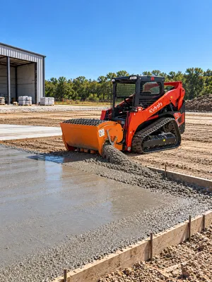 Kubota 75 HP skid steer/bobcat with concrete mixer attachment (Open Cab)