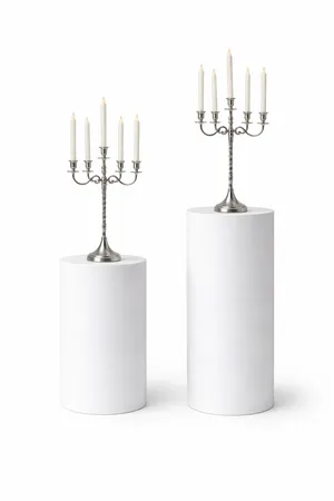 Silver Candelabras on White Pedestals