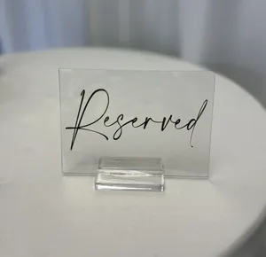 SIGN (Acrylic-clear): Reserved (gold lettering)