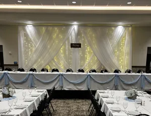 BACKDROP: White sheer drapery & lights 8-12'H x 8-10'W