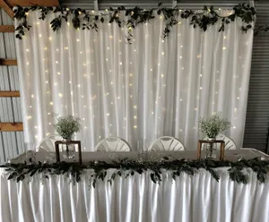 BACKDROP: White drapery & lights 8'H x 6-10'W