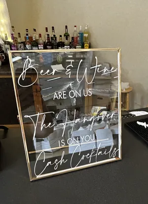 SIGN: Gold frame-Beer & Wine are on us