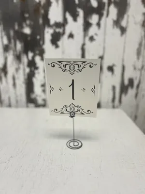 SIGN: Table numbers with black wire holder