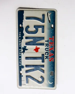 Vintage Texas License Plate with the space shuttle on it.