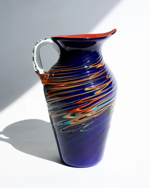Handblown Royal Blue Base with Orange and multicolored Stripes and Red Interior Water Pitcher