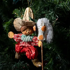 Christmas Tree Ornament: Vintage Child with red and green ranch attire and sombrero playing on a horse broomstick, Paper mache