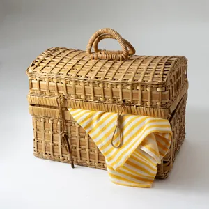 Blond Rectangular Straw Wicker Woven Picnic Basket with and and straw closures.