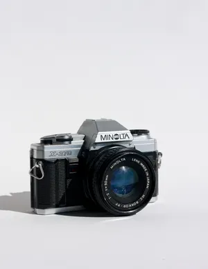 1980s Minolta manual film still photography camera. Black Body with Silver accents. 