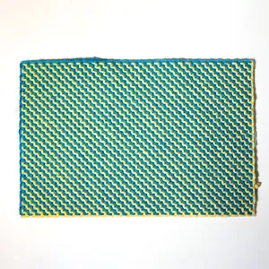 Retro Blue and White Surface with a zig zag pattern in yarn