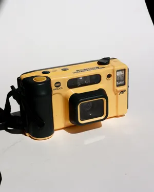 Vintage Minolta Weathermatic Dual 35 Underwater 35mm point and shoot film camera. Yellow Plastic Body Black Corded Strap