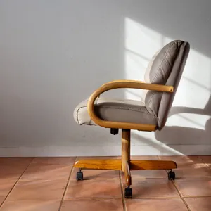80s cushioned dining chair on wheels