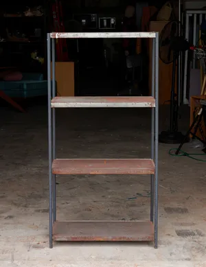 Vintage Metal Industrial Shelf Featuring a Four Shelves with a Weathered Rusty Patina