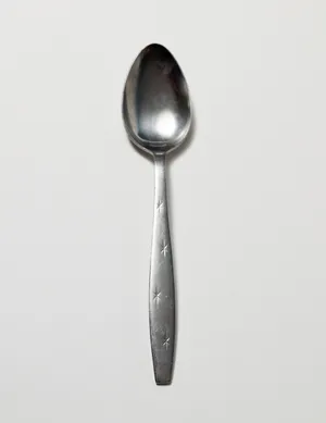 Flatware: Silver Serving Spoon with Pressed Stars in the handle