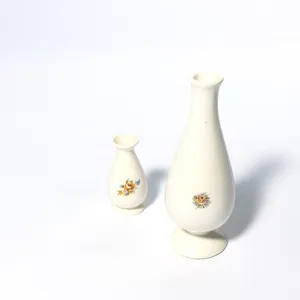 White, Cream Hourglass Bud Vase with Rose Print on the Exterior Flower bud. SMALL VASE NOT INCLUDED- 5.25