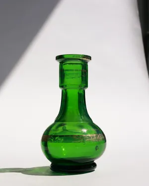 Emerald green decanter or bud vase with gold stripes. Vintage, Mid Century Modern