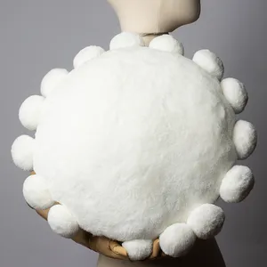 Round White Pillow with puffy balls along the edge - 