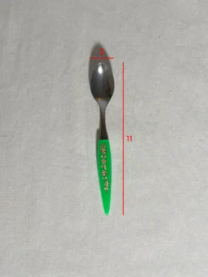 Cucchiaino manico verde in plastica