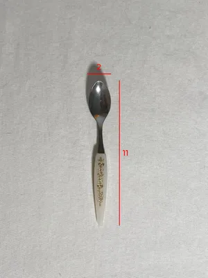 Cucchiaino manico bianco in plastica