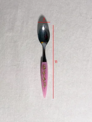 Cucchiaino manico rosa in plastica