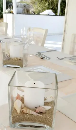 Seashell themed cube vase with candle