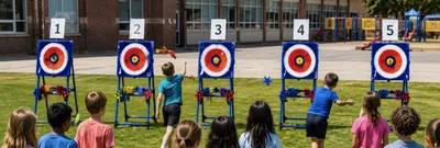 Kids playing an axe throwing game at a school field day competition.